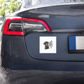 White square TYV Core Mark car magnet displayed on a dark vehicle, with the shirt-and-radiating-voice artwork visible