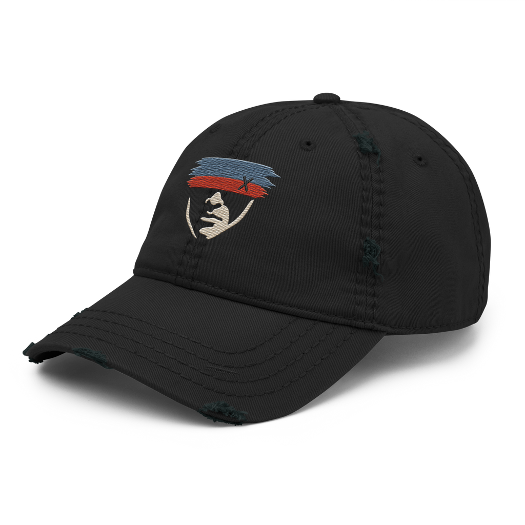 Left front view of Witness Covered Face unlimited embroidery, with a cream face beneath blue and rust-red strokes on a black distressed hat.